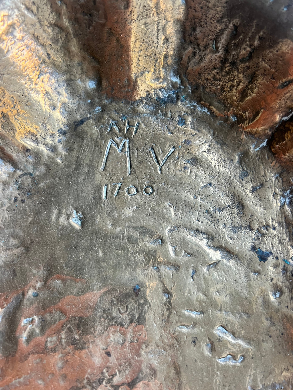 A heavy brass lobe shaped dish with incised initials & date 1700