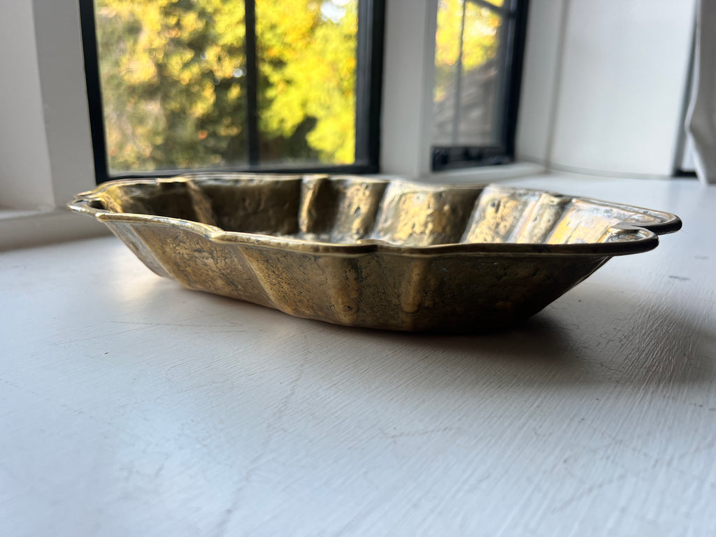 A heavy brass lobe shaped dish with incised initials & date 1700