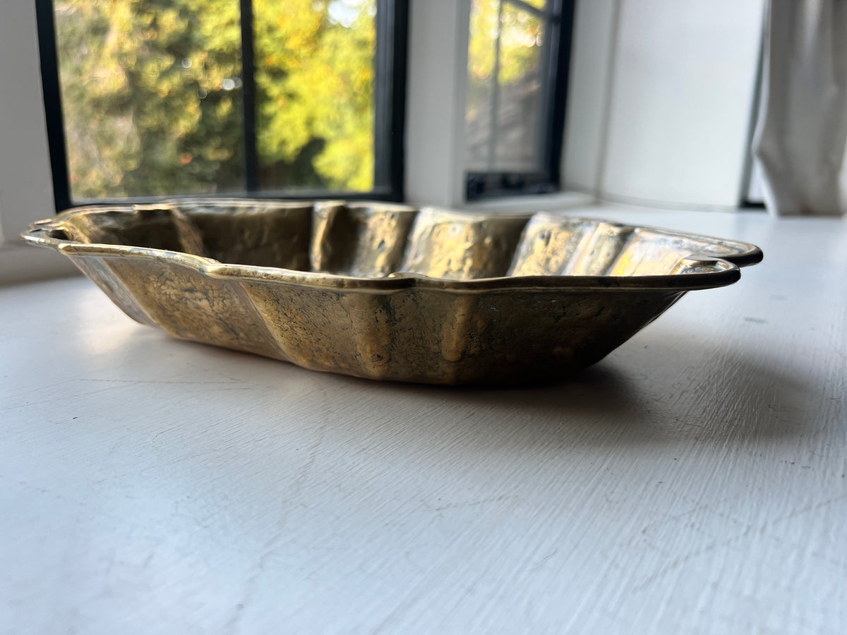 A heavy brass lobe shaped dish with incised initials & date 1700