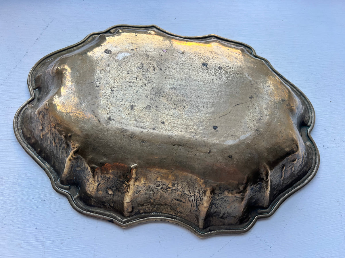 A heavy brass lobe shaped dish with incised initials & date 1700